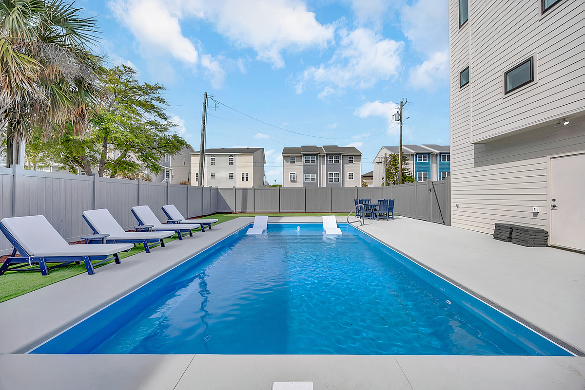 Outdoor pool at Vista Azule Carolina Beach NC family reunion beach house, surrounded by deck space for multiple activity levels